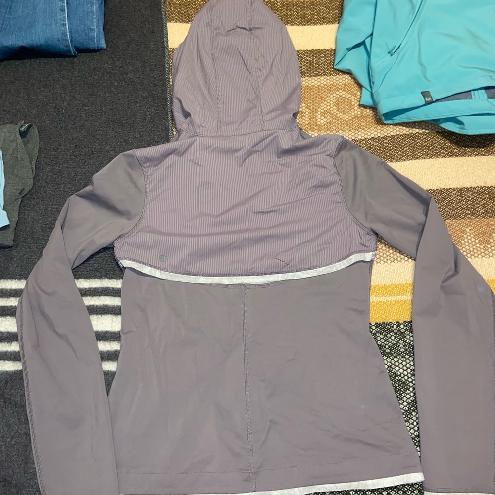 Lavender Lululemon workout hoodie.